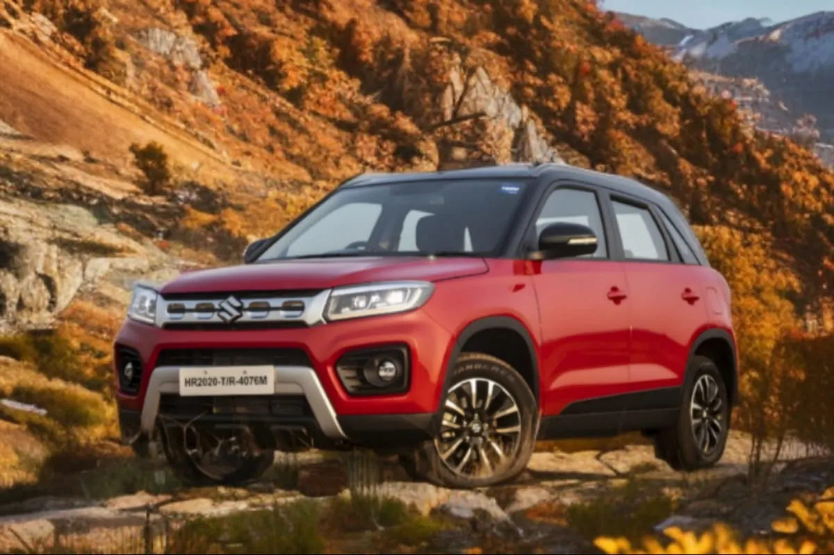 Maruti Brezza parked near trees in a jungle view