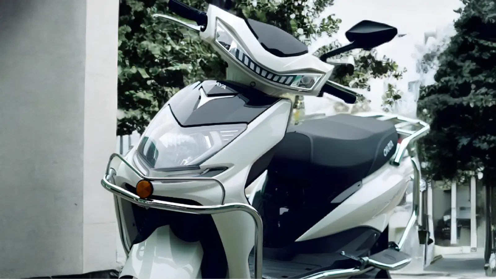 Okaya ClassIQ electric scooter on city road with rider 