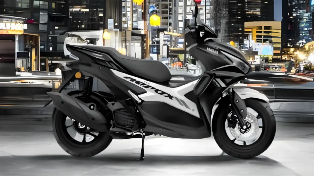 Side view of Yamaha Aerox 155 with rider on urban road